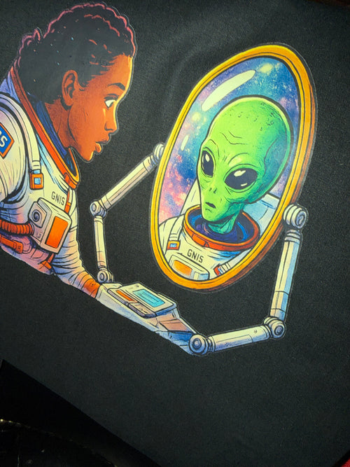 GN15 astronaut looking into a mirror and seeing an alien reflection of herself